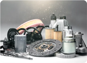 Collection of automotive parts including filters, clutch disc, and engine components.