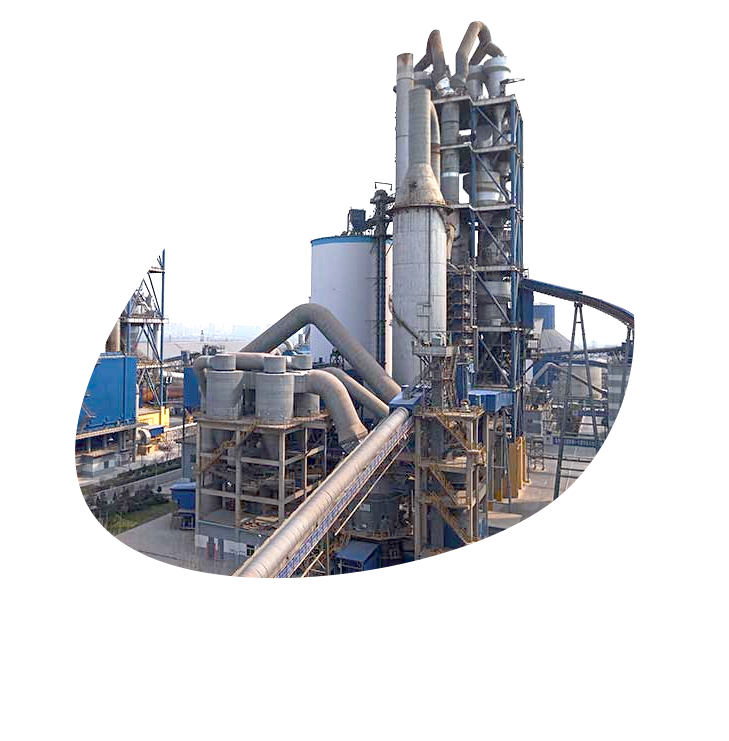Cement plant with concrete silos and processing towers under blue sky.